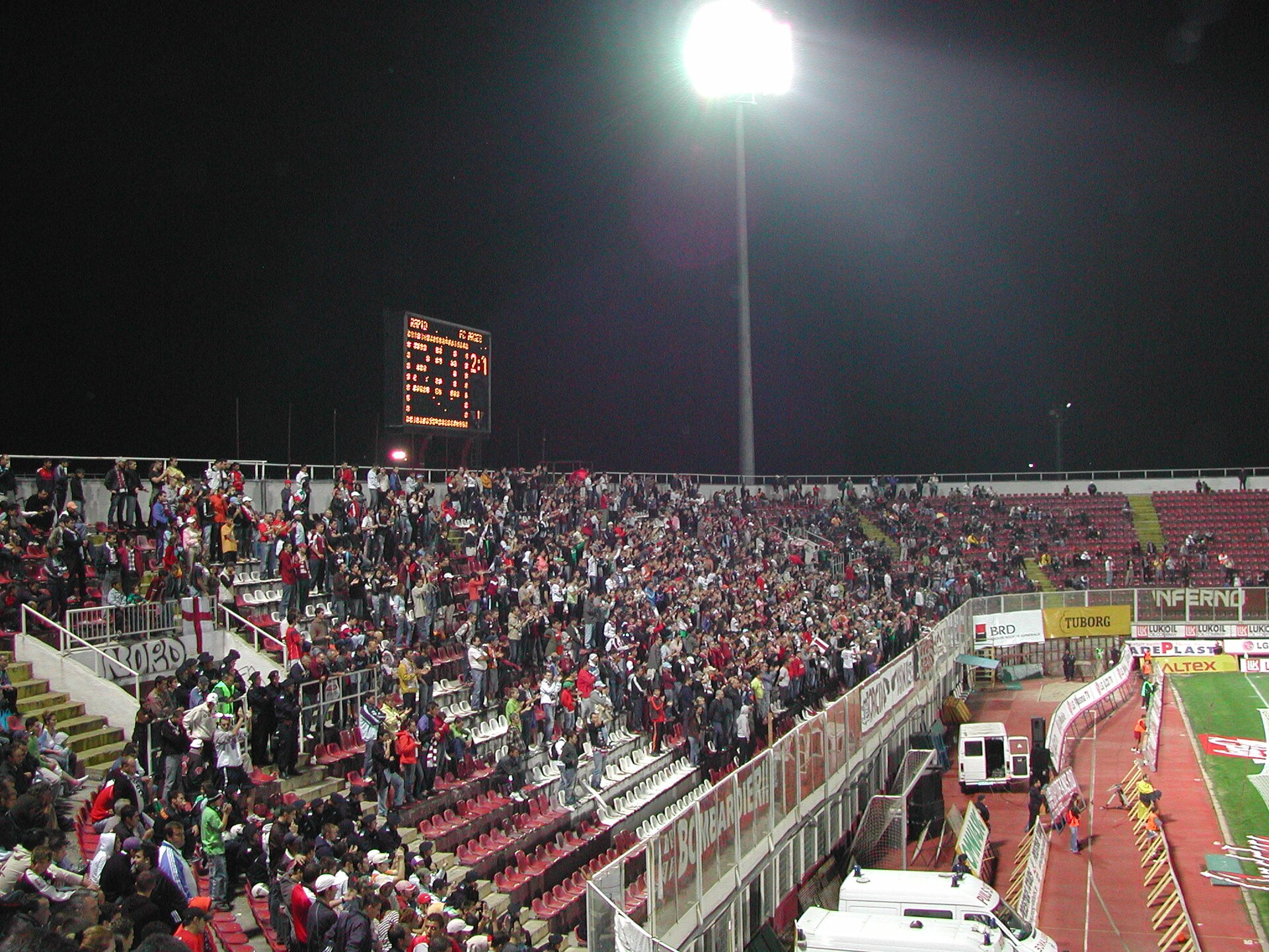 Home soccer supporters filling a stadium stand